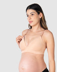 Close-up of Kami, pregnant mother of two, demonstrating the functionality of the HOTMILK NZ nursing and maternity bra named AMBITION T-SHIRT WIREFREE in maple, featuring the convenient magnetic nursing clip