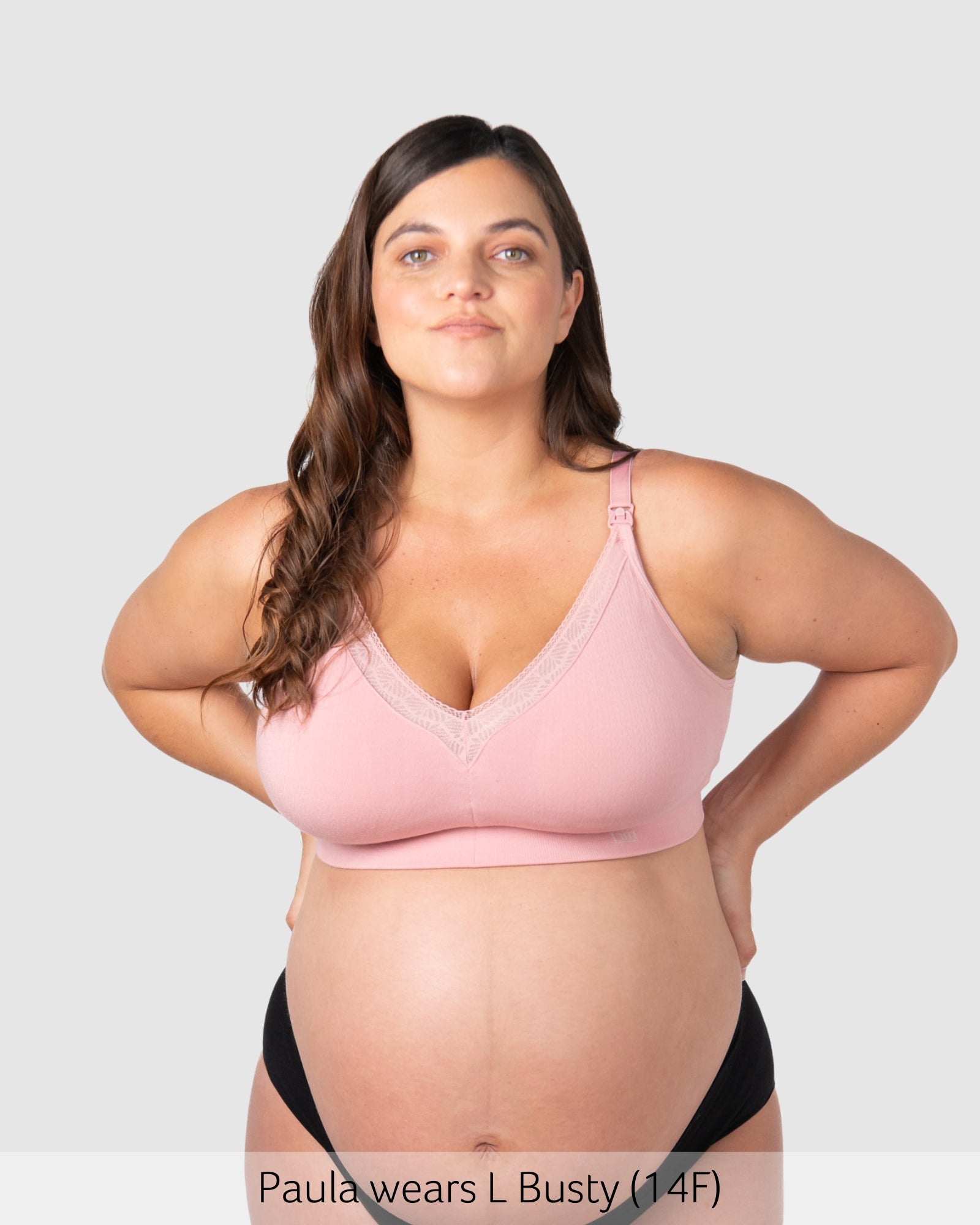 Pregnant woman wearing maternity bra caress by hotmilk
