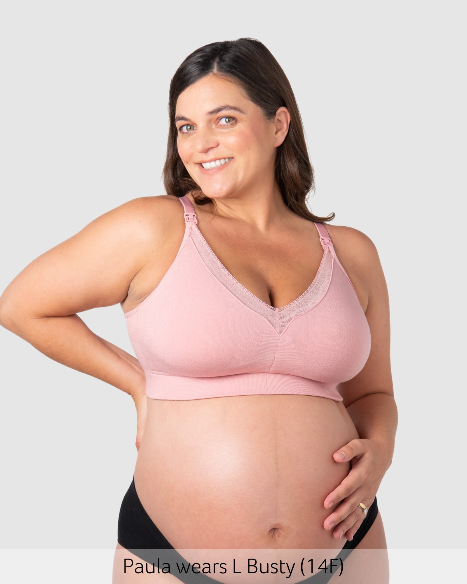 Pregnant woman wearing maternity bra caress by hotmilk