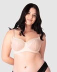 Experience complete support with Hotmilk Lingerie NZ's Temptation in Powder. This acclaimed award-winning style boasts flexi underwire, a hint of sheer lace over soft cotton cups, convenient nursing clips, and elevated all-day comfort and support. Olivia confidently wears size 14/36D in this essential nursing and maternity bra