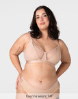 Model wearing the Hotmilk Flawless Plunge Wirefree Nursing Bra in Cashmere with matching briefs – full body front view showing sheer plunge neckline, three-piece cup construction, and gold Hotmilk hardware