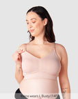 Model wearing Hotmilk My Necessity bra in Ballet Pink, showing front view with nursing clips and full cup support.