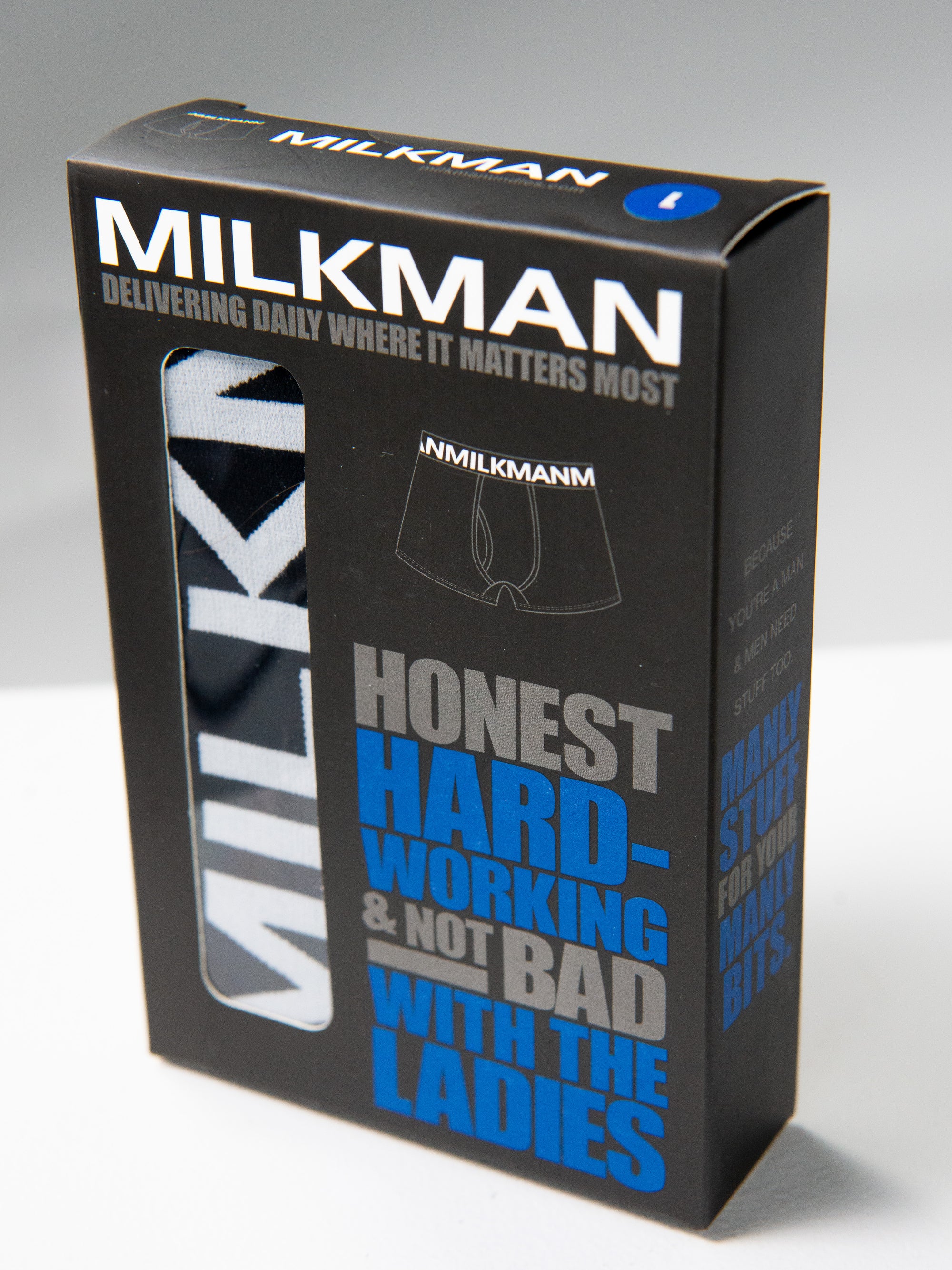 Milkman underwear packaging with text on a gray background