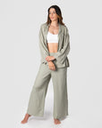 Explore boundless possibilities with Kami, a mother of 2, as she demonstrates Hotmilk's mix-and-match collection by combining the Lounge Top with the Lounge Pant. Crafted from a soft linen blend in a serene Sage color, these pieces offer a comfortable fit and stylish 3/4 length kimono-style sleeves. To complete her perfect loungewear ensemble, Kami adds the My Necessity maternity and breastfeeding bra, ensuring both fashion and functionality in her set