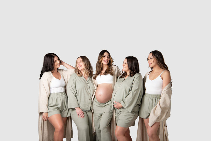 Hotmilks exclusive online only Lounge range group shot featuring 5 mamas wear a comboation of lunge pant, shorts, robe, cami and bras for breastfeeding and pregnancy in comfort. 