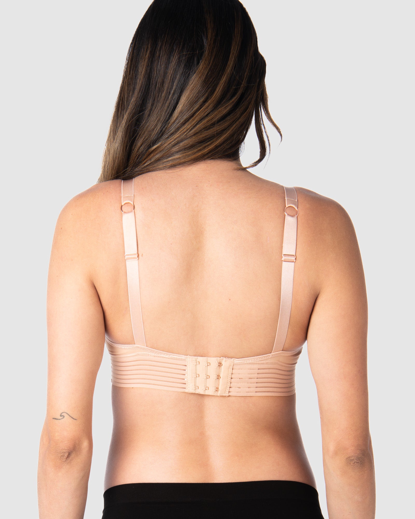 Kami, expecting mother of 2, demonstrating the versatile standard or convertible racerback feature of Hotmilk NZ&#39;s Ambition T-Shirt Wirefree nursing and maternity bra in shell pink, designed for maternity, nursing, and breastfeeding comfort