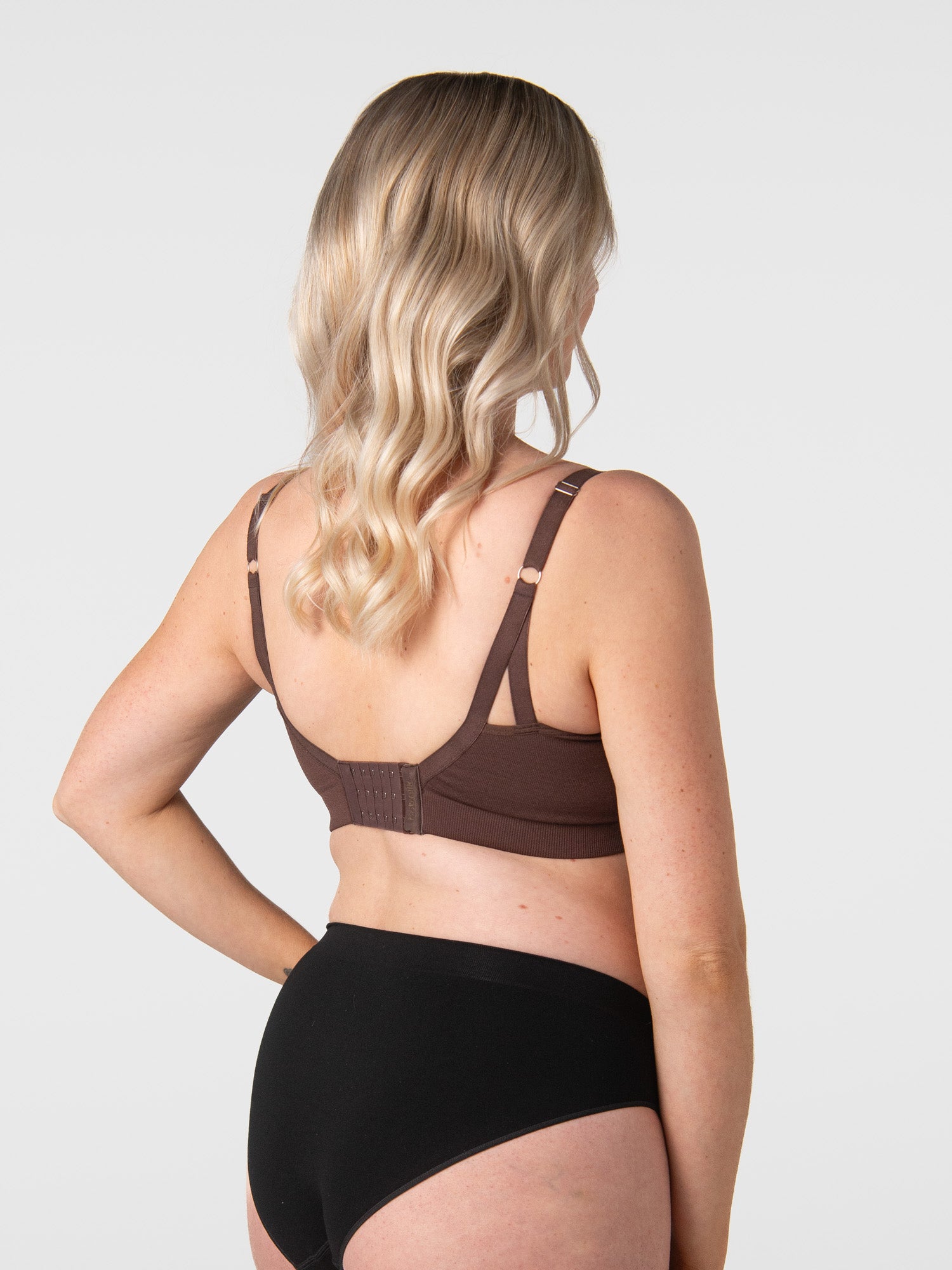 Adele wears My Necessity Chocolate back view showing clasps