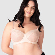 Experience complete support with Hotmilk Lingerie NZ's Temptation in Powder. This acclaimed award-winning style boasts flexi underwire, a hint of sheer lace over soft cotton cups, convenient nursing clips, and elevated all-day comfort and support. Olivia confidently wears size 14/36D in this essential nursing and maternity bra