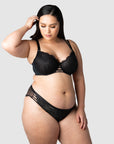 Tailored for the modern mother, Hotmilk Lingerie's best-selling nursing lingerie set combines the True Luxe nursing bra with the semi-sheer floral lace bikini. Embrace your unique style, expertly designed to provide support and lift for larger bust sizes up to J cup. Tiare, a mother of 2, confidently showcases the True Luxe nursing bra in semi-sheer floral black 16/38F, paired with the matching brief, making it an ideal choice for capturing the beauty of maternity photo shoots