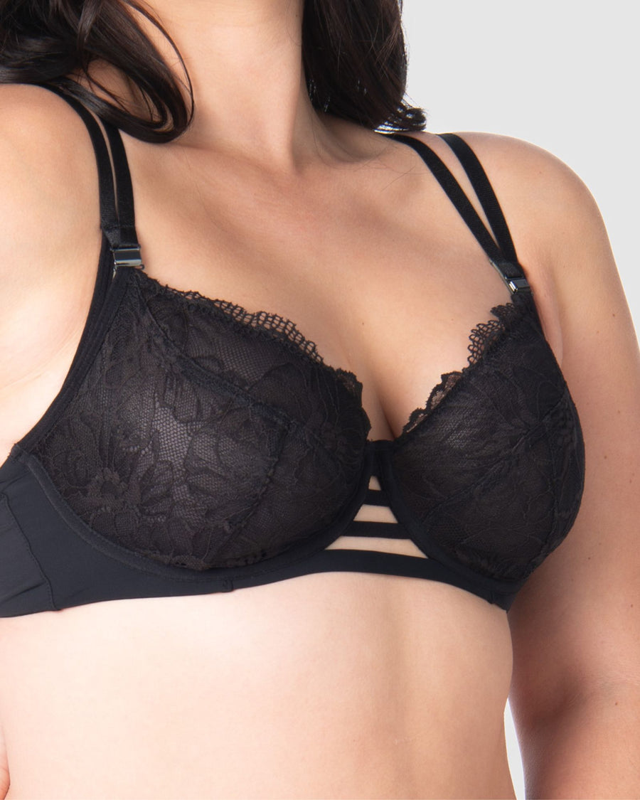 Take a closer look at the True Luxe by Hotmilk Lingerie NZ in black, showcasing its contemporary twin strap detailing, semi-sheer full cup coverage, and flexi underwire support. The modern signature magnetic nursing clips and center cutouts elevate this style to the next level of sophistication. Embrace empowerment throughout your breastfeeding journey with this exquisite bra, designed to accommodate cup sizes up to J cup, without making any compromises