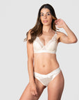 Kami, mama of 2 confidently expresses her personality and style with the coordinated Warrior Plunge Black nursing and breastfeeding bra and briefs in Ivory. Featuring an edgy design, graphic lace, and magnetic clips for added flair, this ensemble is elevated by the supportive features of contour cups and flexi underwire, providing both comfort and lift, perfect for maternity photoshoots