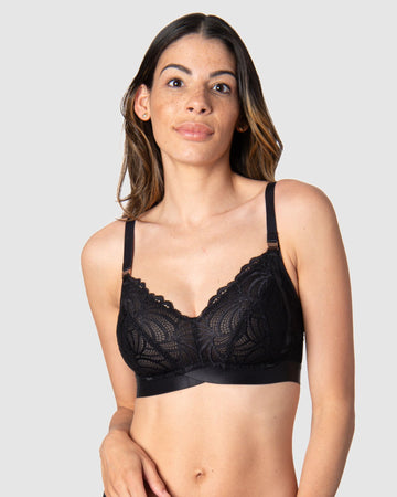 Kami, a mother of two, revels in the comfort and versatile style of Hotmilk Lingerie's Warrior Soft Cup in Black. This wire-free maternity and nursing bra offers the ideal blend of lightness and youthfulness, boasting rose gold magnetic nursing clips and sheer graphic lace for a contemporary touch. Experience comfort and style seamlessly combined in this modern maternity essential