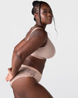 Side profile of model wearing the Hotmilk Flawless Plunge Wirefree Nursing Bra in Cashmere with matching lace briefs – showing sleek cup silhouette and smooth wirefree support