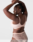 Rear view of model wearing the Hotmilk Flawless Plunge Wirefree Nursing Bra in Cashmere – showing 6-hook back closure, gold-tone adjustable straps, and matching lace briefs