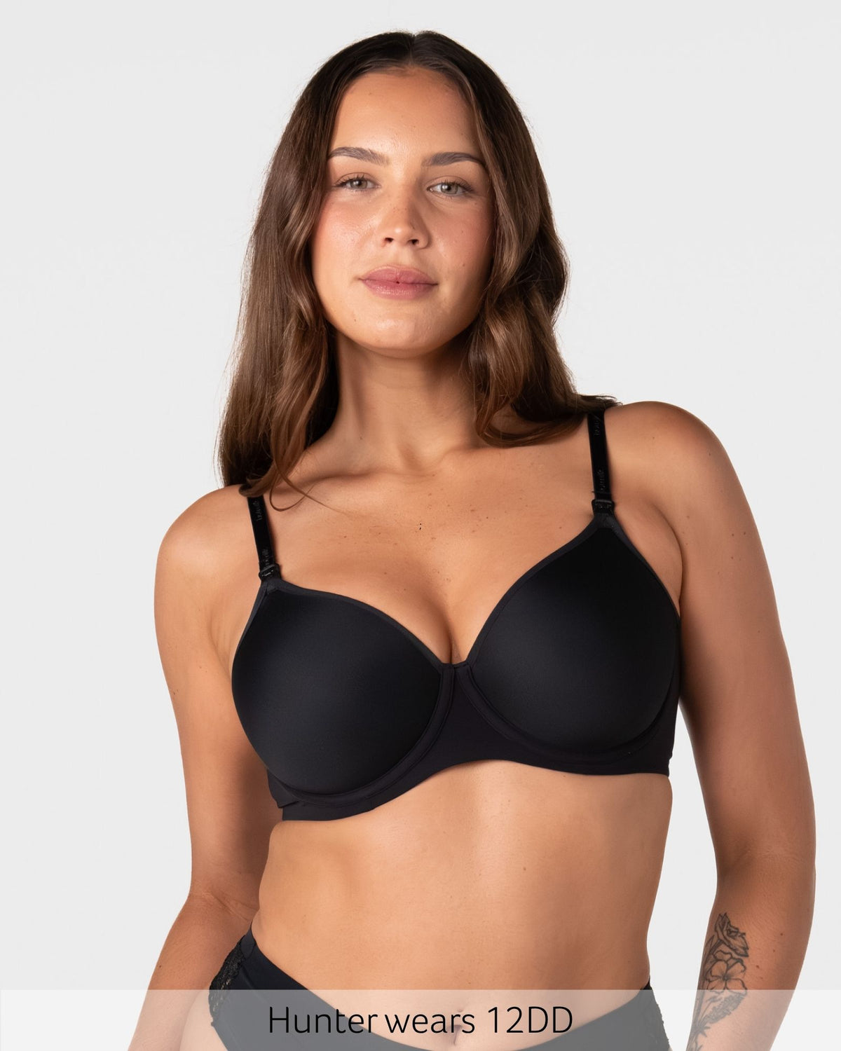 Hunter wears size 12DD in the Forever New black t-shirt nursing bra with seamless spacer foam cups for a smooth everyday fit