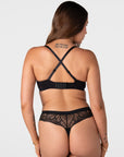 Forever New black maternity t-shirt bra worn in racerback style with crossed-over adjustable straps and wide 6 hook closure