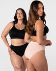 Two models wearing the Hotmilk My Necessity Seamless Bikini Briefs in Black and Frappe – three-quarter view showing smooth seamless fit and flexible everyday silhouette, paired with the My Everyday Nursing Bra in Black