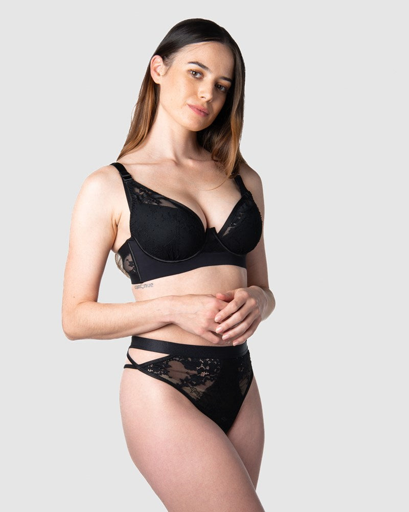 Hotmilk Lingerie&#39;s Goddess g-string forms a captivating date night ensemble, beautifully matched with the Goddess Plunge bra as modeled by Emily, a mother of 1. This set showcases edgy strap details and intricate large floral lace
