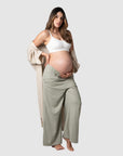 Meet Kami, a mother of 2, proudly showcasing Hotmilk's 'Sage Lounge Pant' paired with the Lounge Robe and My Necessity nursing bra during her 9th month of pregnancy. These pants are the perfect fusion of sumptuous linen, a soft waistband, and a flattering 7/8 length that ensures both style and comfort. Discover the ultimate loungewear for pregnancy and postpartum relaxation with Hotmilk's Sage Lounge Pant