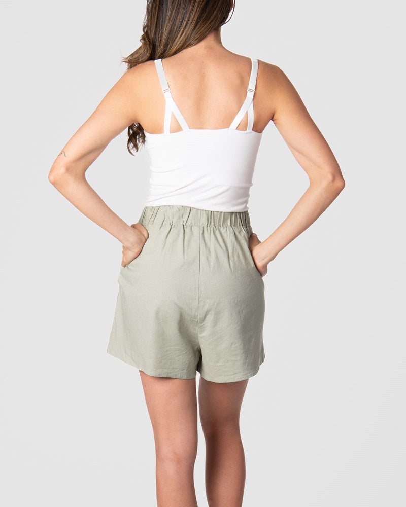 Experience the allure of the Hotmilk 'Sage Lounge Short,' especially when paired with the Hotmilk My Necessity nursing cami to create the ultimate postpartum lounge set. These shorts embody sumptuous comfort, boasting a soft waistband and a flattering above-knee length that seamlessly combines style and relaxation. If you're in pursuit of the perfect loungewear for pregnancy and postpartum comfort, your search ends with Hotmilk's Sage Lounge Short