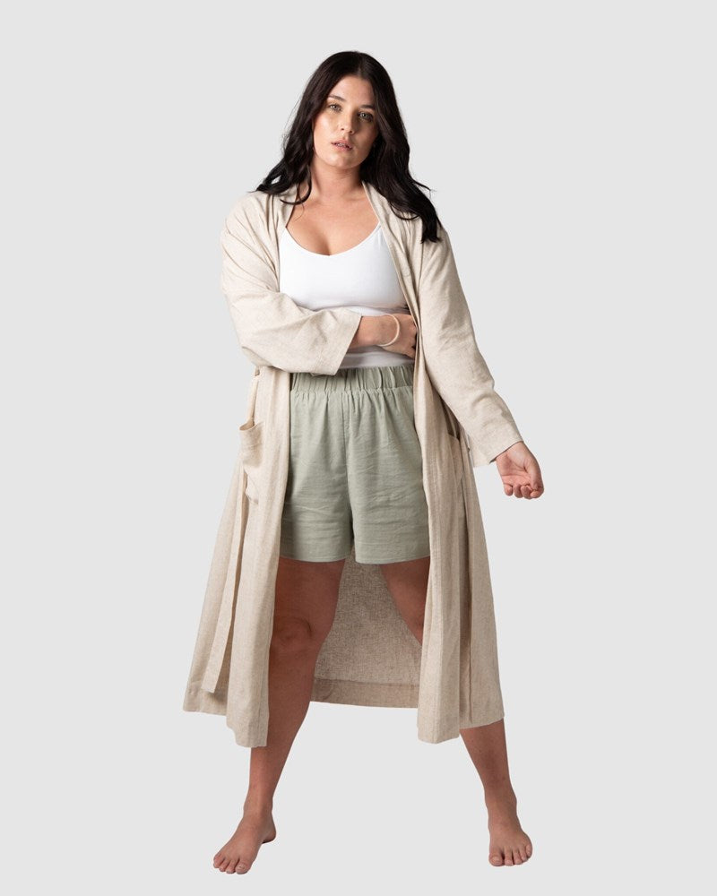 Olivia presents the new Hotmilk Linen Blend Lounge Robe, artfully paired with Lounge Shorts and My Necessity Nursing Cami. Designed with a versatile 3/4 length suitable for all heights, deep pockets, and a luxurious everyday feel, this robe is a remarkable addition that elevates your motherhood journey, spanning from pregnancy to postpartum